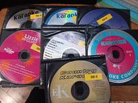 Page of binder holding all seven karaoke discs