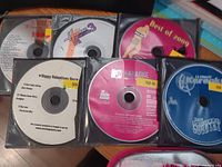Six karaoke discs in sleeve showing titles
