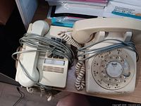 Both telephones side by side on desk
