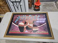 Front view of framed abstract giclée print with gold frame