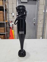 Front view of Black+Decker immersion blender showing full body and blending shaft