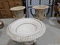 Front view showing all three urn planters