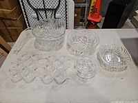 Group shot of punch bowl, ladle, 12 cups, 2 bowls, square side dish