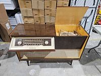 Full view of Loewe-Opta console open showing radio section left and turntable right