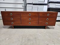 Front view of nine-drawer dresser