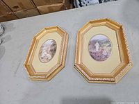 front view of both octagonal framed prints
