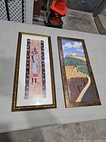 Both framed prints side by side on table