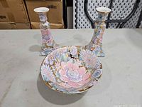 Bowl front view with two candlesticks showing matching pattern and form