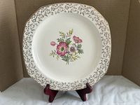 Full view of Alfred Meakin dinner plate on stand