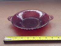 Top view showing full dish, handles, color, and tape for diameter