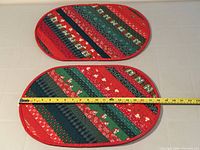 Both placemats shown with measuring tape for scale
