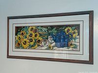 Full view of framed sunflower print on wall