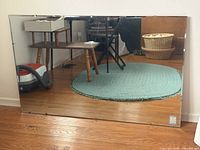 Full view of mirror front showing rectangular shape, bevelled edges and size reference