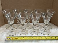 Front view of all nine liqueur glasses aligned