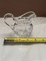 Front angled view with tape measure showing width ~4.5 in