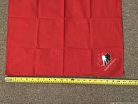 Full napkin laid flat with tape measure showing roughly 22 inch width