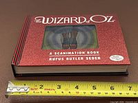 Front cover showing title, scanimation window, ruler for size reference