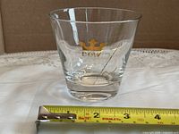 Front view of Dow cocktail glass with tape measure for scale