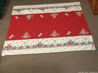 Full view of rectangular tablecloth laid flat showing overall design and color placement