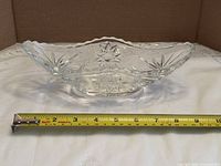 Top view of entire dish with tape showing length