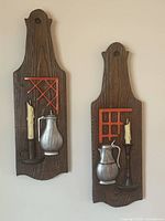 Front view of both embossed plaster wall plaques