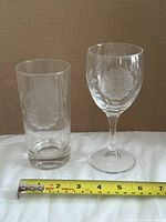 Both glasses side by side with horizontal tape for scale