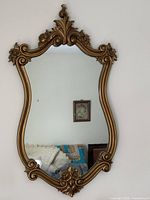 Full view of gilded rococo wall mirror