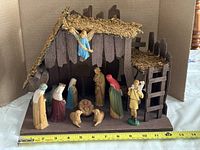 full view stable and figurines with tape for width