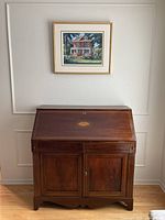 Full frontal view of closed mahogany bureau