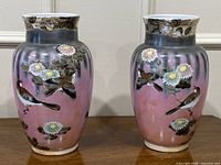 Front view of both matching hand-painted Japanese porcelain vases