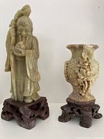 Full view of Shouxing figure and vase on stands