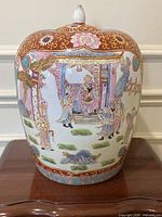 Front view of hand-painted famille rose ginger jar with lid