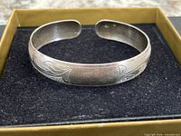 Full view of sterling cuff bracelet resting in box