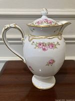 Full view of teapot right side showing floral design and gold accents