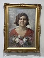 Framed oil portrait of woman with roses