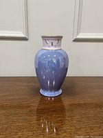 Front view of iridescent blue porcelain vase