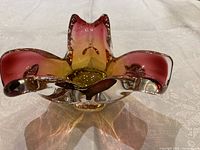 Oblique view showing pink rims, yellow centre, clear casing, overall shape