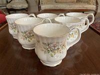 Group of six Royal Albert Haworth mugs showing pattern and shape