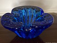 Front view of cobalt blue Murano art glass bowl showing biomorphic shape and controlled bubbles