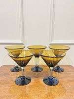 front view of all five blue dessert cups on table