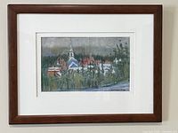 Framed pastel artwork on wall