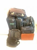 Group of rolling suitcases, attaché, messenger, briefcases, portfolio