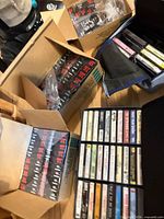 Multiple boxes of sealed Brother TZe-231 label tapes and cassette carry case with tapes