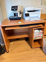 Front view showing entire desk, top, shelves, wheels