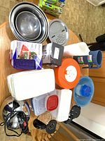 Overall lot showing containers, bowls, batter dispenser box, pitchers, steamer, salad bowl, suction handles and bag boxes