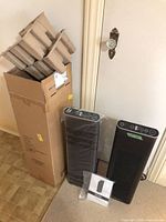 Boxed and unboxed Ionic Pro Platinum air purifiers with packaging