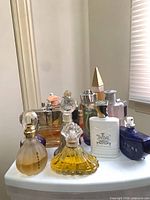 Front view of grouped perfume bottles on table