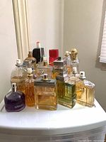 Group of assorted perfume bottles on a surface