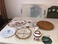 All items laid out on table with plastic tote behind