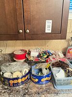 Overview of five bins and contents on countertop